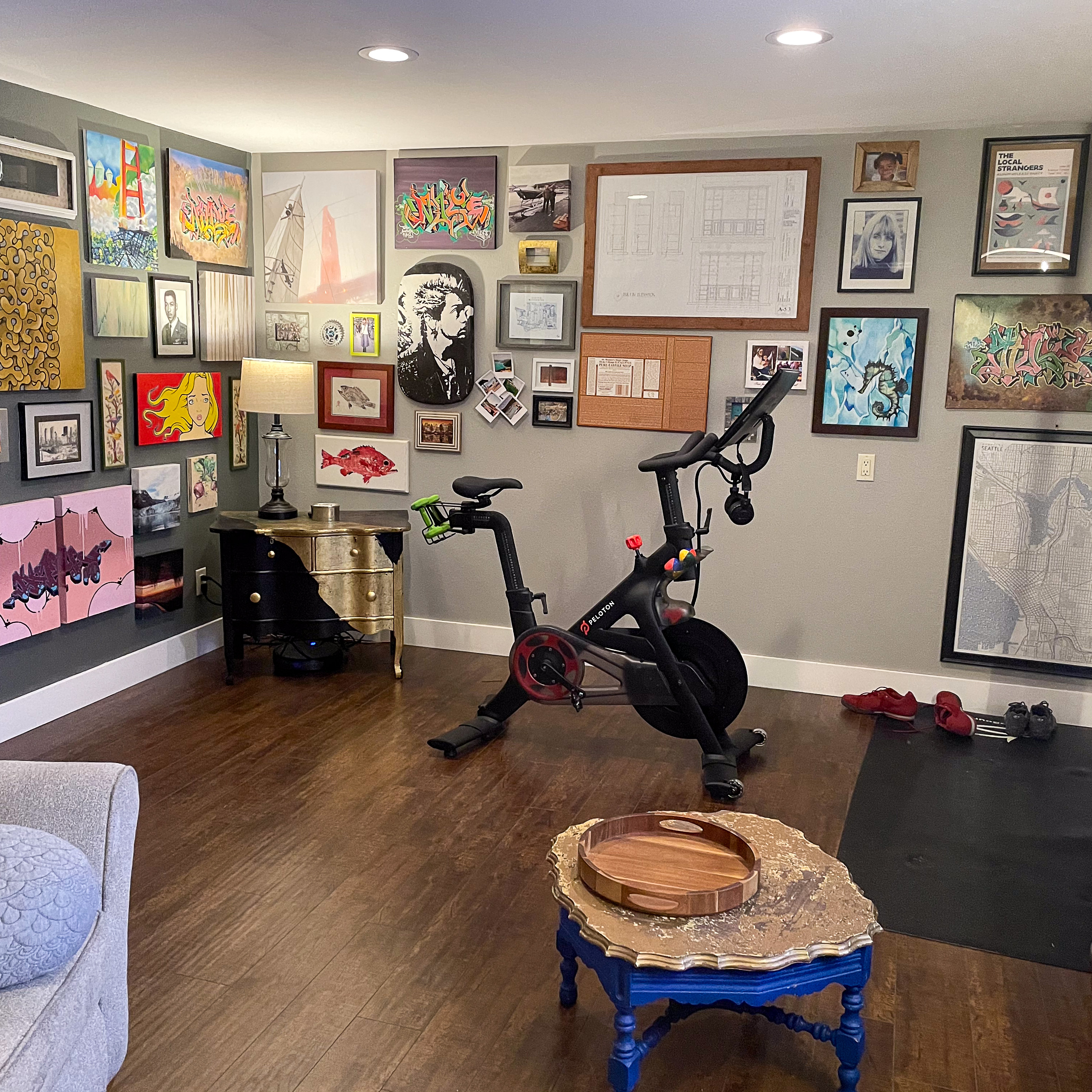 Tidy garage workshop with tool bags, a rolling tool chest, and labeled storage cubes.